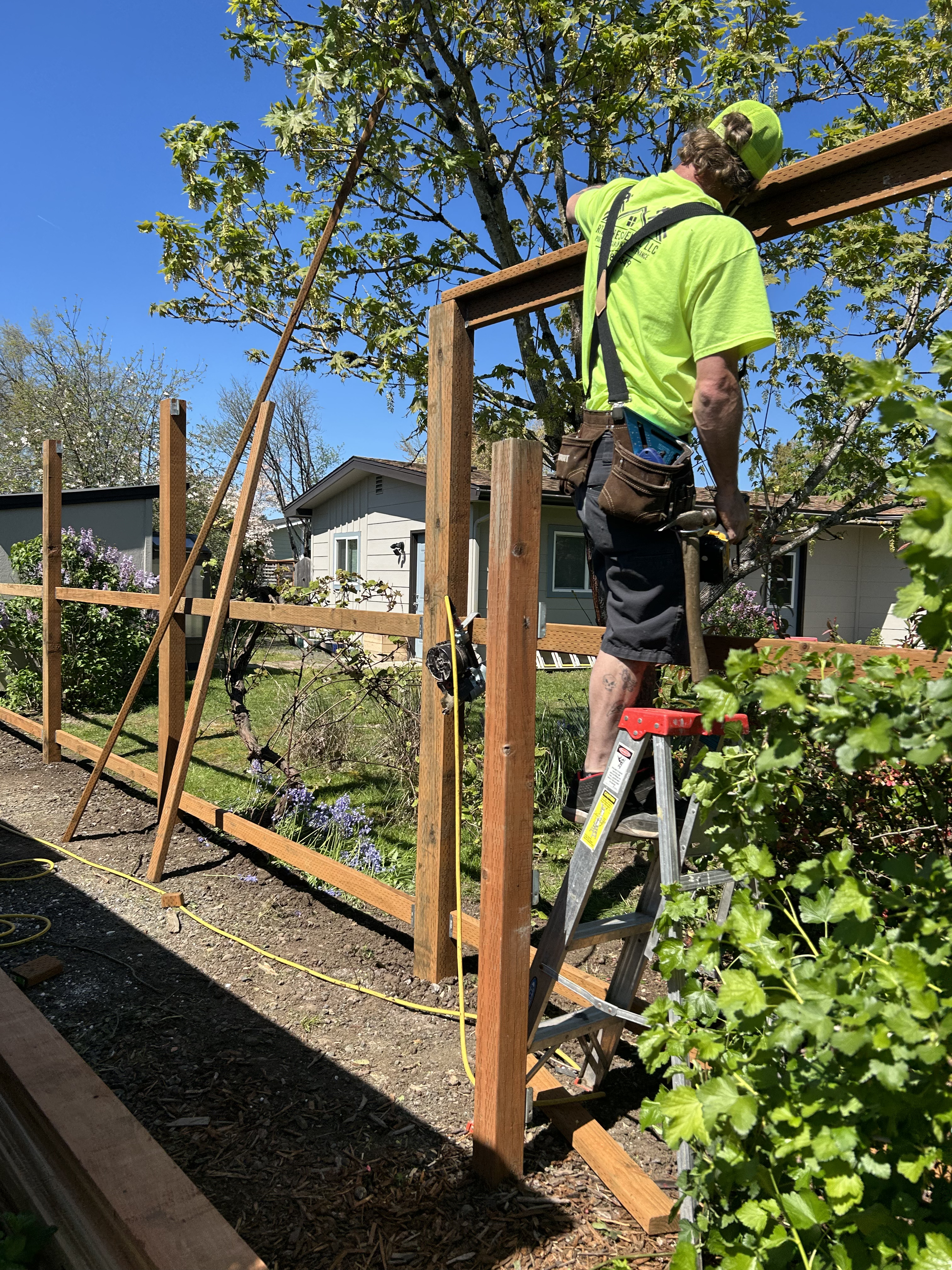 Fence construction in progress on residential property